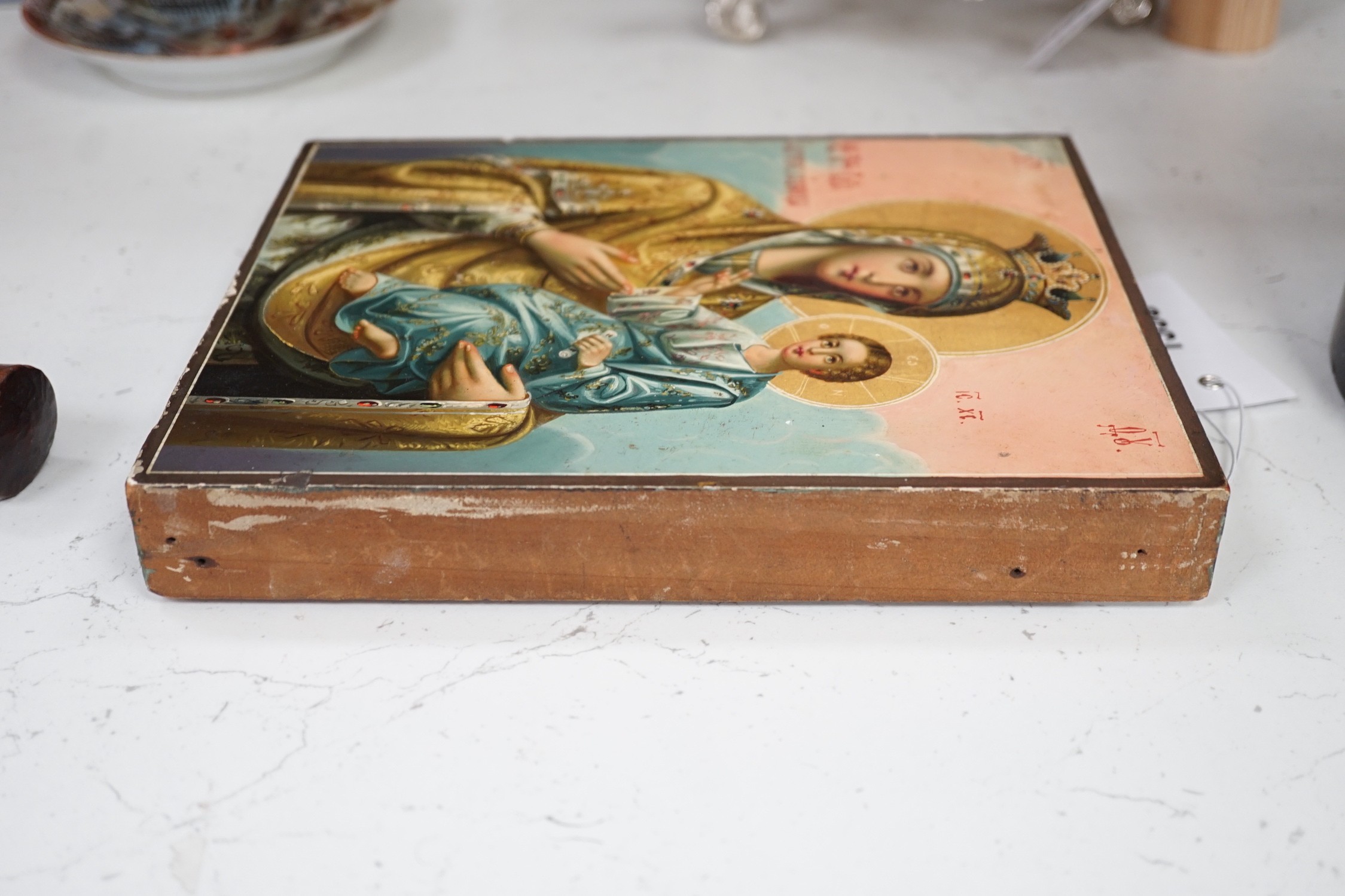 A Russian painted wood icon of Virgin and child, 22.5x18cm
